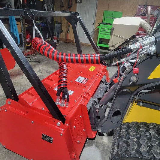 The Outback Wrap Hose Honcho - a heavy‑duty hydraulic hose protection sleeve - on an implement.