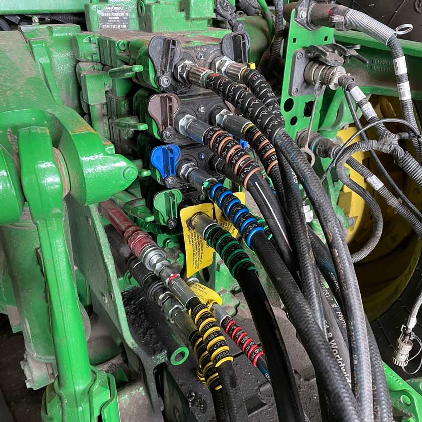 another view of outback wrap hydraulic hose markers being used to label planter hydraulic hoses.